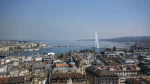 Caption: A Scenic View Of Geneva, Switzerland At Sunset Wallpaper
