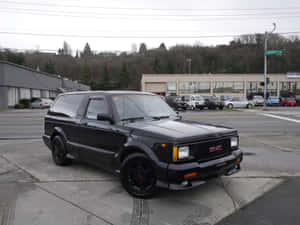 Caption: A Stunning Gmc Typhoon In Action Wallpaper