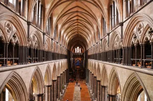 Caption: A Warm Sunrise Over The Salisbury Cathedral Wallpaper