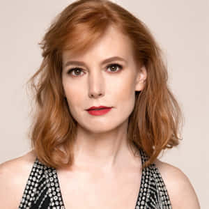 Caption: Actress Alicia Witt Striking A Pose Wallpaper