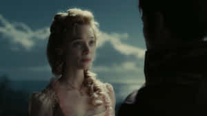 Caption: Actress Bella Heathcote Charming Pose Wallpaper