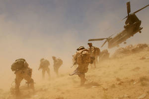 Caption: Afghanistan Military Forces In A Desert Storm Wallpaper