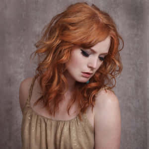 Caption: Alicia Witt's Stunning Portrait Wallpaper Wallpaper