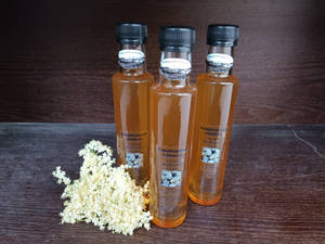 Caption: Artisan Elderflower Cordial Bottles Wallpaper