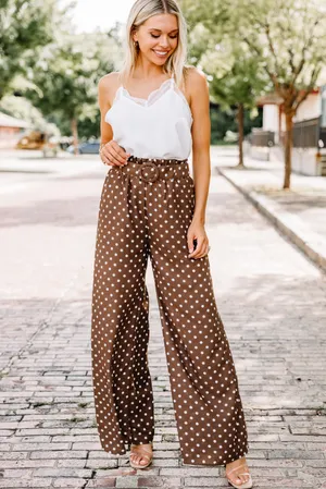 Caption: Artistic Design Of Brown Polka Dots Pattern Wallpaper