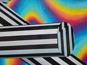 Caption: Artistic Rainbow Stripes Design Wallpaper