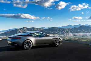 Caption: Aston Martin Db11 In Style - Sleek Performance Meets Unmatched Elegance Wallpaper