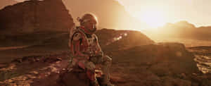 Caption: Astronaut Mark Watney Exploring Mars In The Martian Movie Wallpaper