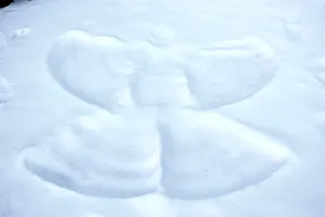 Caption: Beautiful Snow Angel On A Winter Day Wallpaper