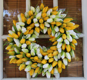 Caption: Beautiful Spring Wreath With Colorful Flowers On Rustic Wooden Door Wallpaper