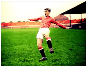 Caption: British Soccer Icon Duncan Edwards In Action Wallpaper
