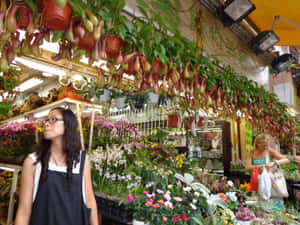 Caption: Bustling Flower Market Wallpaper