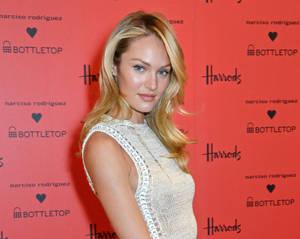 Caption: Candice Swanepoel Shines At The Bottletop Event Wallpaper