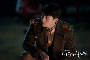 Caption: Captain Ri Jeong-hyeok Of Crash Landing On You, Imposing In Uniform Wallpaper