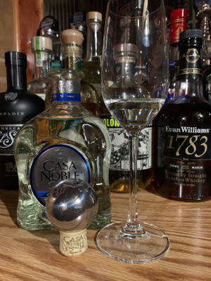 Caption: Casa Noble Crystal Blanco Tequila In An Elegant Champagne Glass Wallpaper