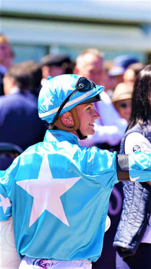 Caption: Champion Jockey Jamie Kah In Her Racetrack Element Wallpaper