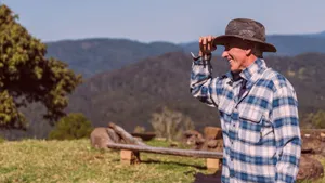 Caption: Cheerful Farmer Enjoying His Work Wallpaper