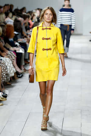 Caption: Chic Style In Yellow Fashion Wallpaper