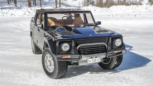 Caption: Classic Lamborghini Lm002 On A Scenic Cruise Wallpaper