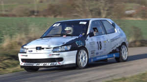 Caption: Classic Peugeot 306 In Pristine Condition Wallpaper