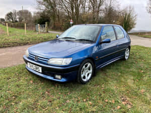 Caption: Classic Peugeot 306 In Pristine Condition Wallpaper