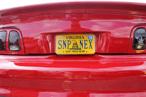 Caption: Close-up Image Of A Car License Plate Wallpaper