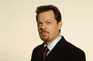 Caption: Comedian Eddie Izzard During A Stand-up Performance Wallpaper