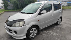 Caption: Compact Elegance - Daihatsu Yrv 2000 Wallpaper