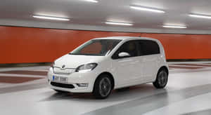 Caption: Compact Elegance, The Skoda Citigo In Action. Wallpaper