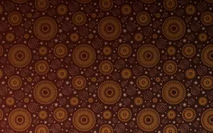 Caption: Conventional Symmetrical Circle Pattern On A Brown Wallpaper Wallpaper