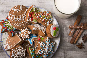 Caption: Delicious Christmas Cookies With Milk And Cinnamon Wallpaper