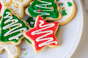 Caption: Delightful Star-shaped Christmas Cookies Wallpaper