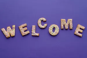 Caption: Delightful Welcome Cookies In Letter Shapes Wallpaper