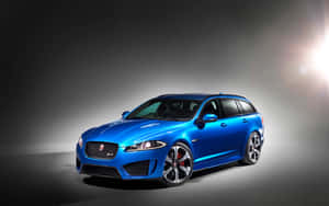 Caption: Dynamic And Stylish Jaguar Xfr In Action Wallpaper