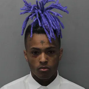 Caption: Dynamic Portrait Of Xxxtentacion With Blue Hair Wallpaper