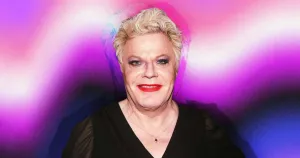 Caption: Eddie Izzard Performing On Stage Wallpaper