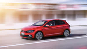 Caption: Elegance On Wheels: Volkswagen Polo In Action Wallpaper