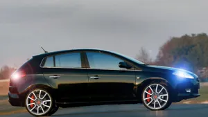 Caption: Elegant Fiat Bravo In Stunning Landscape Wallpaper