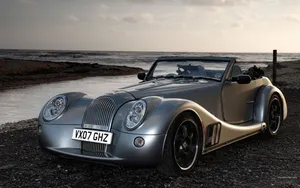 Caption: Elegant Morgan Sports Car Wallpaper