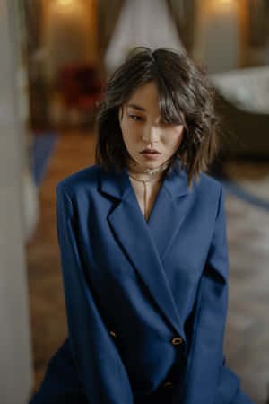 Caption: Elegant Navy Blue Blazer For A Sophisticated Look. Wallpaper