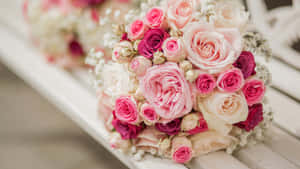 Caption: Elegant Wedding Bouquet In Bride's Hands Wallpaper