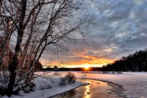 Caption: Enchanting Winter Sunset Wallpaper