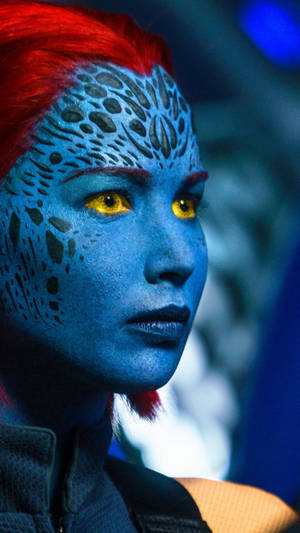 Caption: Engaging Gaze Of Mystique With Yellow Eyes Wallpaper