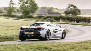 Caption: Evoking Power And Elegance - The Mclaren 540c Wallpaper