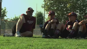 Caption: Exciting Little League Baseball Game In Action Wallpaper