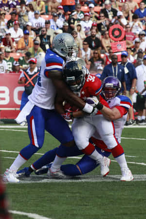 Caption: Exciting Moment At The Nfl Pro Bowl Game Wallpaper