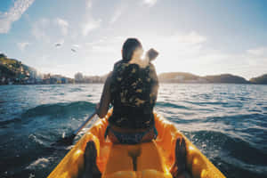 Caption: Exhilarating Kite Surfing Adventure On A Sunny Day Wallpaper