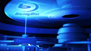 Caption: Extensive 4k Blu-ray Collection Displayed On Shelves Wallpaper