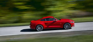 Caption: Ford Mustang California Special Cruising Along The Coastline Wallpaper