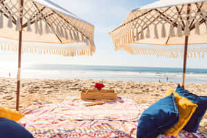 Caption: Friends Enjoying A Beach Picnic On A Sunny Day Wallpaper